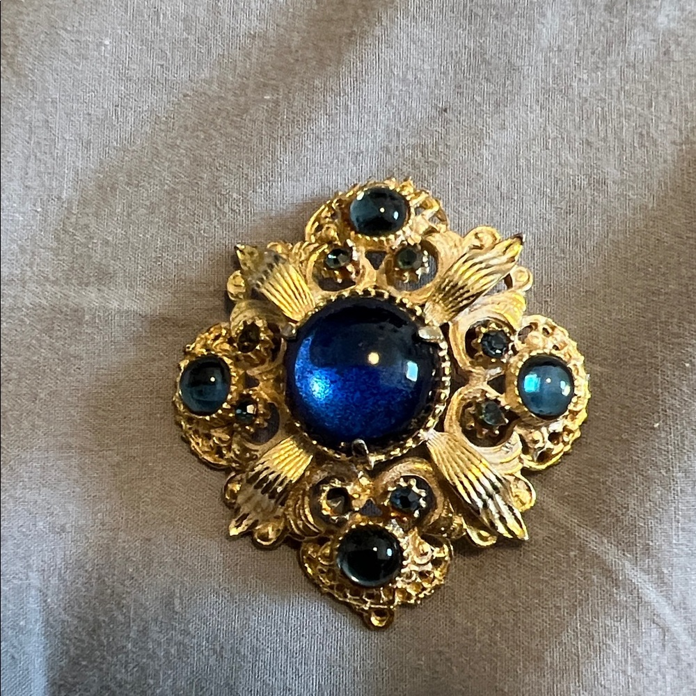 Elegant Gold and Blue Brooch